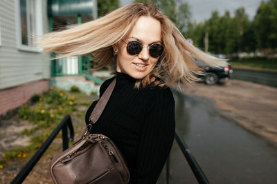 Close-up. a beautiful girl is enjoying a summer day in the city.