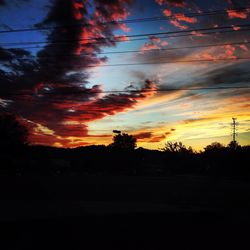 Silhouette of trees against sky at sunset