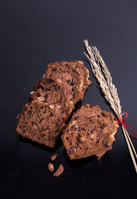 Close-up of bread against black background