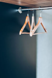 Close-up of clothes hanging on wooden table