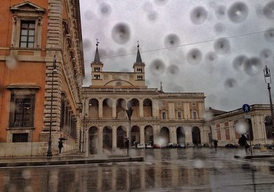 View of buildings against cloudy sky