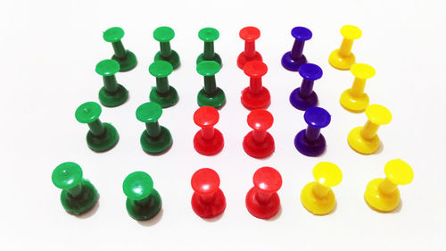 High angle view of multi colored pencils over white background