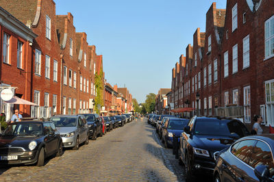 City street amidst buildings against sky