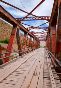 View of railroad tracks against bridge