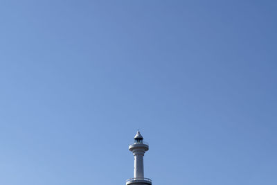 Low angle view of lookout tower against clear blue sky