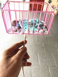 High angle view of man holding cigarette