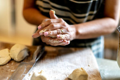 Midsection of person preparing food