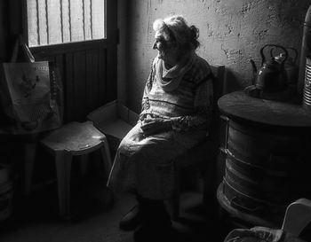 Midsection of woman at home