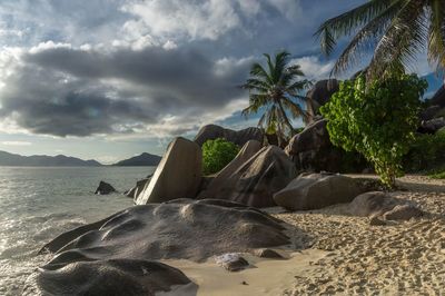 View of beach against cloudy sky