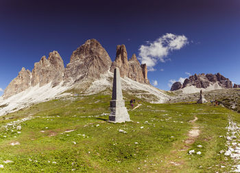 Low angle view of built structure on mountain against sky