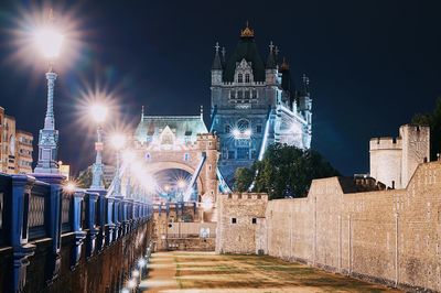 Illuminated buildings in city at night