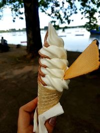 Hand holding ice cream cone