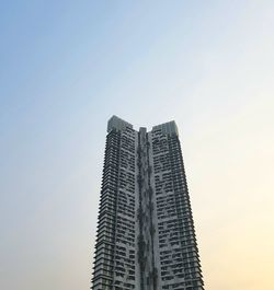 Low angle view of skyscrapers against clear sky