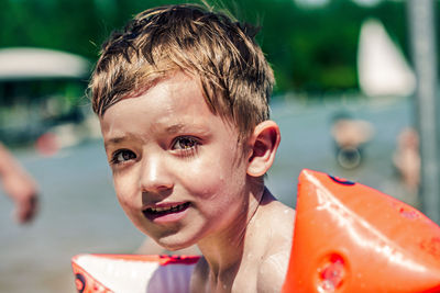 Portrait of shirtless boy in swimming pool