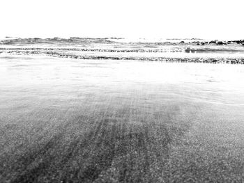 Scenic view of beach against clear sky