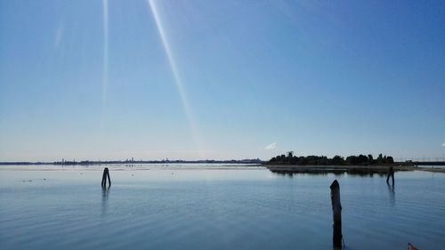 Scenic view of sea against clear blue sky