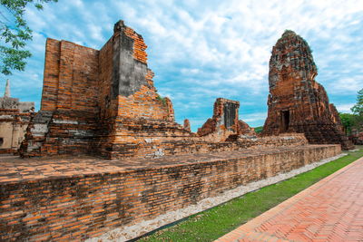 Low angle view of old temple building against sky