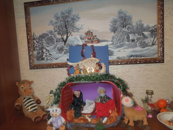 Christmas decorations on tree in snow