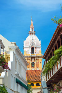 Low angle view of cartagena cathedral against blue sky in city