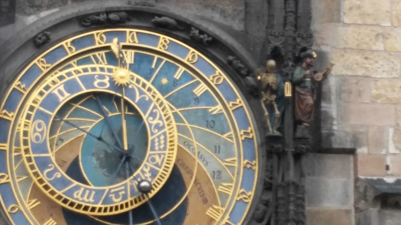 CLOSE-UP OF CLOCK ON BUILDING