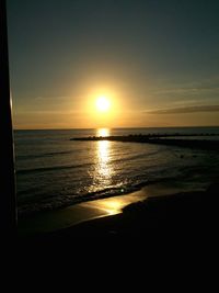 Scenic view of sea at sunset