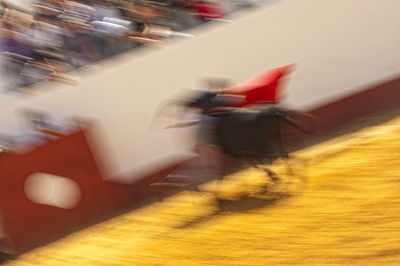 Blurred motion of people riding motorcycle