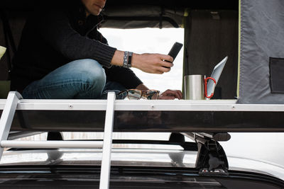 Man working from a tent to social distance from the office