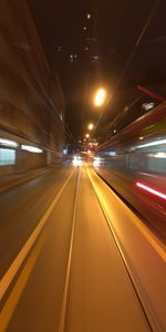 Light trails on bus at night