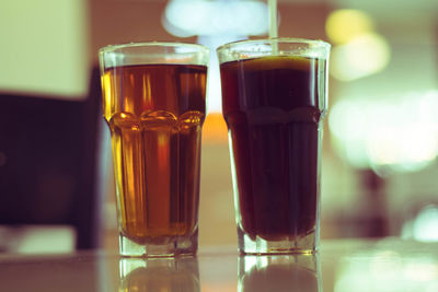 Close-up of beer in glasses on table