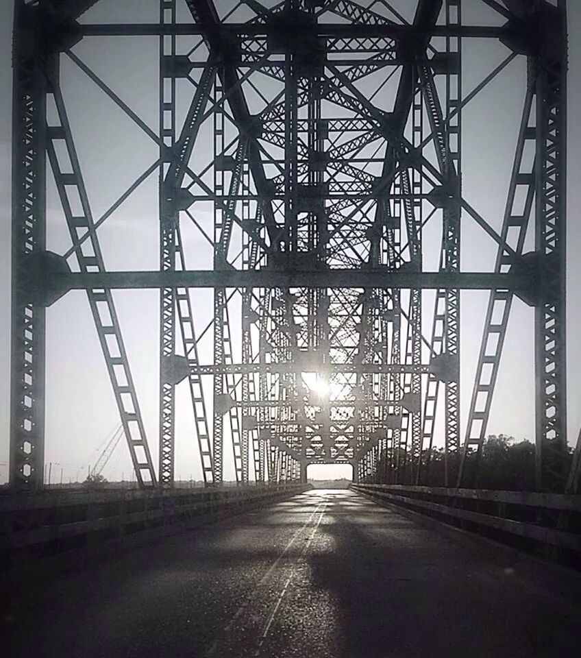 transportation, the way forward, connection, diminishing perspective, road, vanishing point, built structure, bridge - man made structure, long, architecture, electricity pylon, sky, street, engineering, power line, outdoors, no people, car, road marking, empty