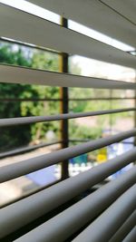 Close-up of railing against window