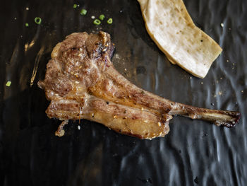 High angle view of meat on barbecue grill