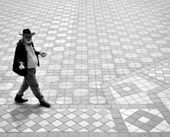 Shadow of man walking on street