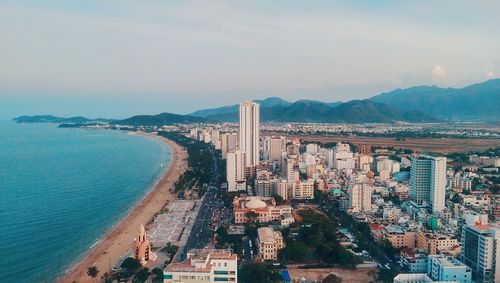 View of sea with cityscape in background