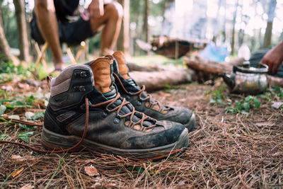 Close-up of shoes on land