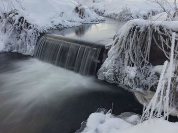 Scenic view of frozen waterfall