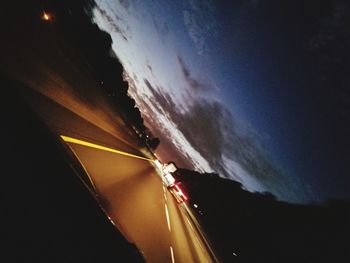 Blurred motion of car on road at night