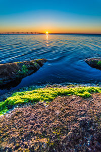 Scenic view of sea at sunset