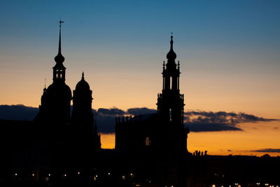 Low angle view of city at sunset