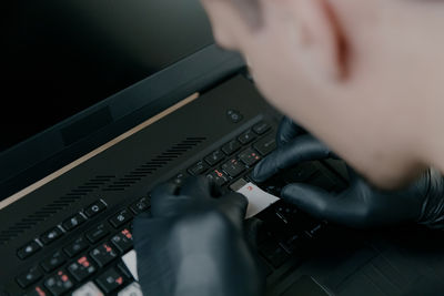 Cropped hand of man using sound mixer