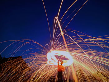 Light trails against sky at night