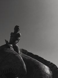 Low angle view of statue against sky