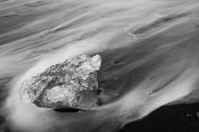 Close-up of rock in sea