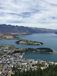 High angle view of lake wakatipu by mountain against sky