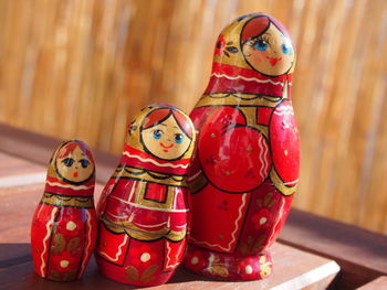 Close-up of red matryoshka dolls on table at home