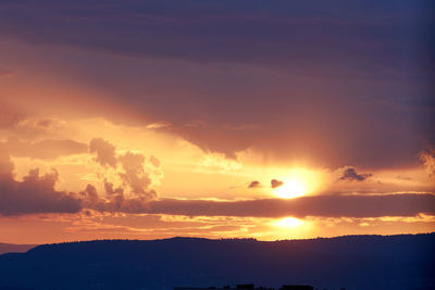 Scenic view of dramatic sky during sunset