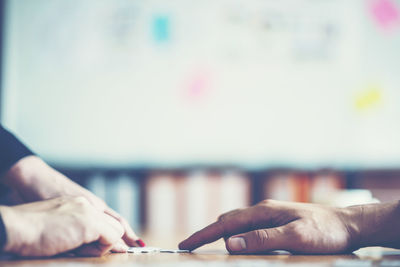 Close-up of hand holding table