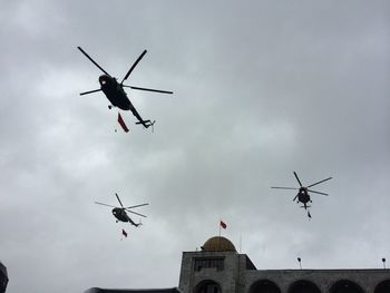 Low angle view of airplane flying in sky