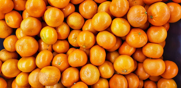 Full frame shot of oranges at market stall