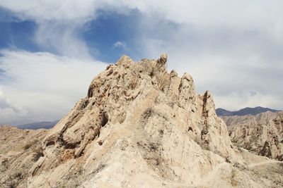 Rock formations on mountain against sky